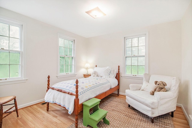 5145 Hensley Dr, Ann Arbor, MI 48103 - bedroom featuring light wood-style floors and multiple windows