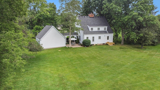 5145 Hensley Dr, Ann Arbor, MI 48103 - view of grassy yard with a patio area