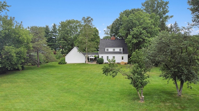 5145 Hensley Dr, Ann Arbor, MI 48103 - view of grassy yard featuring a deck