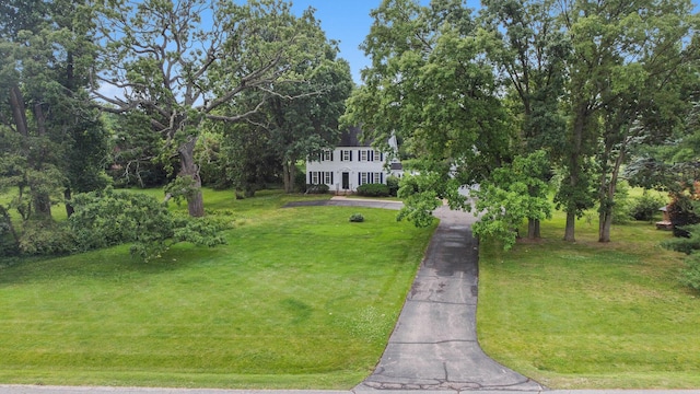 5145 Hensley Dr, Ann Arbor, MI 48103 - view of front of home with a front lawn, driveway, and view of wooded area