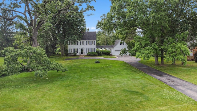 5145 Hensley Dr, Ann Arbor, MI 48103 - colonial inspired home with driveway, an attached garage, and a front lawn