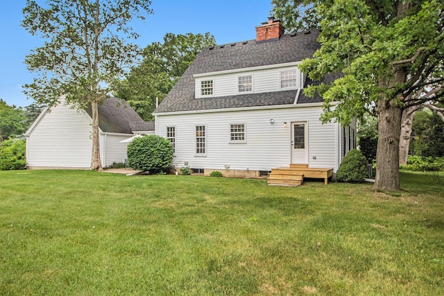 5145 Hensley Dr, Ann Arbor, MI 48103 - back of property featuring a shingled roof, a lawn, and a chimney