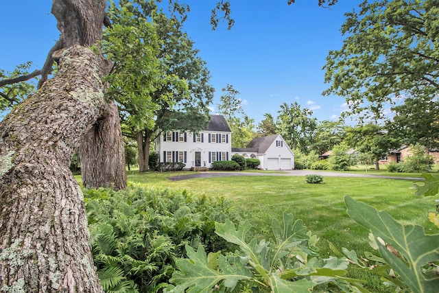 5145 Hensley Dr, Ann Arbor, MI 48103 - view of green lawn featuring a garage