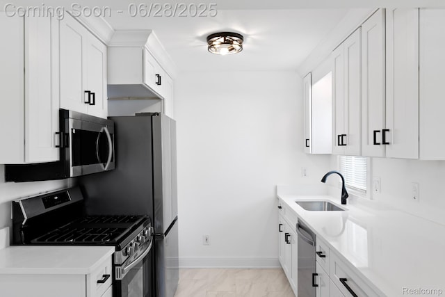 1590 Chapin Ave, Birmingham, MI 48009 - kitchen featuring stainless steel appliances, light marble finish floors, white cabinetry, and light countertops