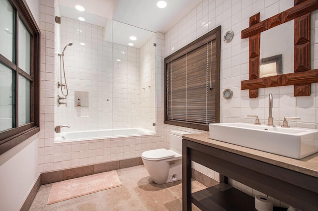 7085 Youngren Rd, Three Oaks, MI 49128 - full bathroom with tile walls, tiled shower / bath, recessed lighting, vanity, and tile patterned flooring