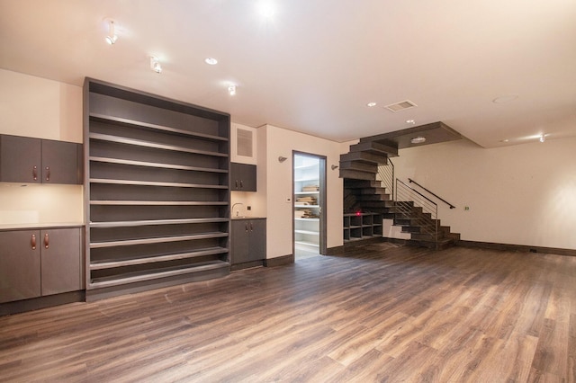 7085 Youngren Rd, Three Oaks, MI 49128 - unfurnished living room featuring stairs and wood finished floors
