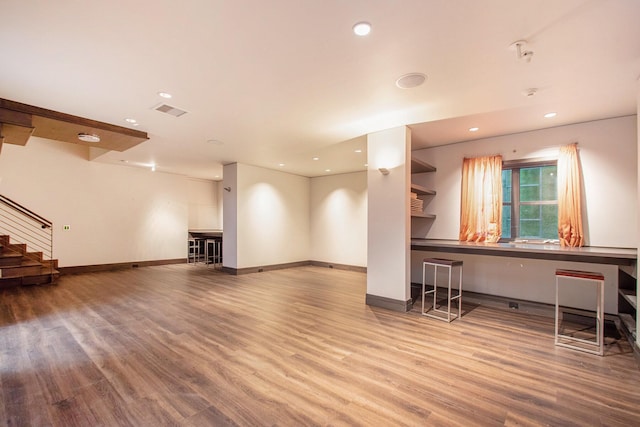 7085 Youngren Rd, Three Oaks, MI 49128 - living room with wood finished floors, recessed lighting, and stairs