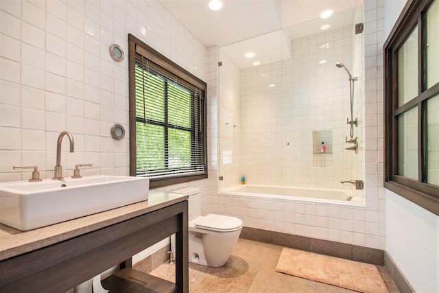 7085 Youngren Rd, Three Oaks, MI 49128 - full bath with tile walls, vanity, tiled shower / bath, and recessed lighting