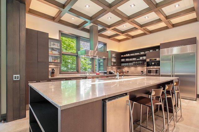 7085 Youngren Rd, Three Oaks, MI 49128 - kitchen with open shelves, built in refrigerator, coffered ceiling, beam ceiling, and a spacious island