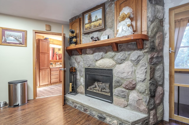 7702 N Gleneagle Dr, Kalamazoo, MI 49048 - detailed view of wood finished floors and a stone fireplace