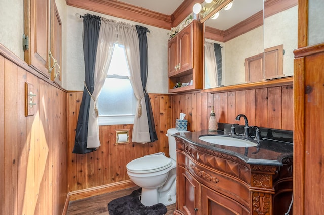 7702 N Gleneagle Dr, Kalamazoo, MI 49048 - half bathroom with crown molding, vanity, wooden walls, wainscoting, and wood finished floors