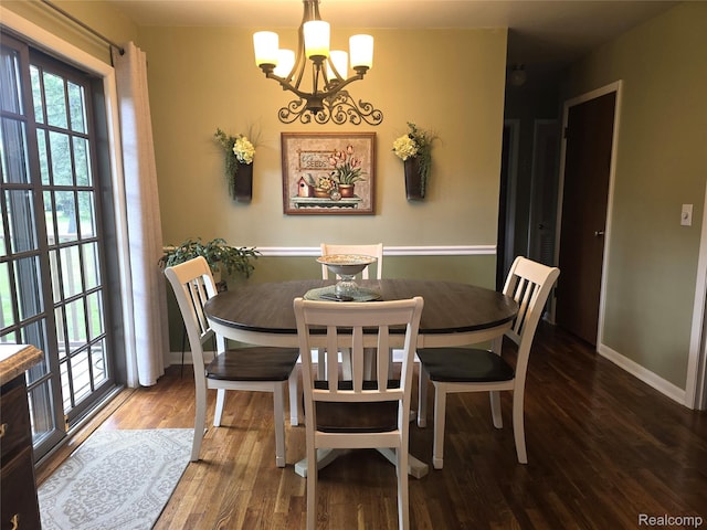 11019 Washington Ave, Mount Morris, MI 48458 - dining space featuring a chandelier and wood finished floors