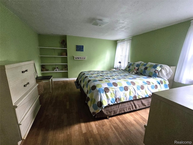 11019 Washington Ave, Mount Morris, MI 48458 - bedroom featuring wood finished floors and a textured ceiling