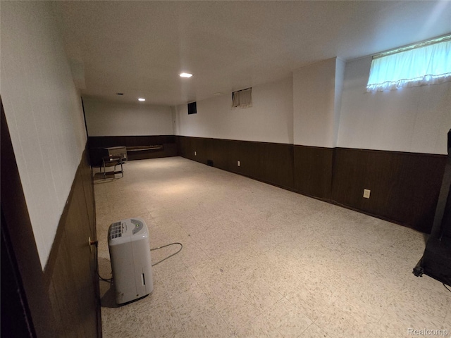 11019 Washington Ave, Mount Morris, MI 48458 - basement featuring wainscoting, tile patterned floors, and wooden walls