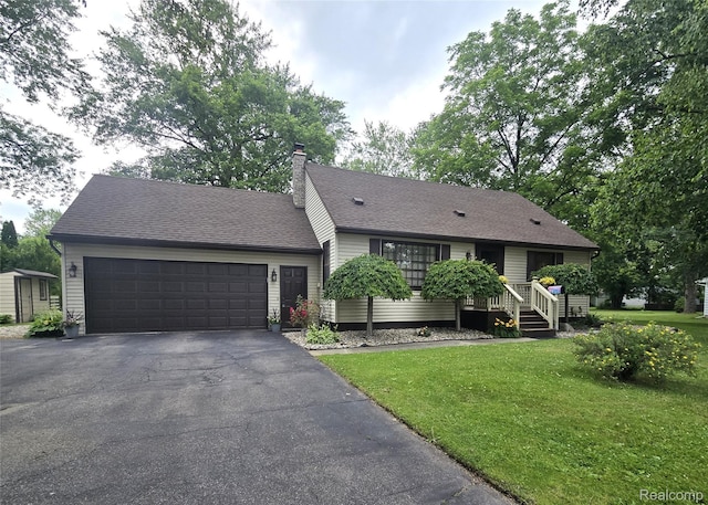11019 Washington Ave, Mount Morris, MI 48458 - ranch-style house featuring driveway, a garage, a front lawn, a chimney, and a shingled roof
