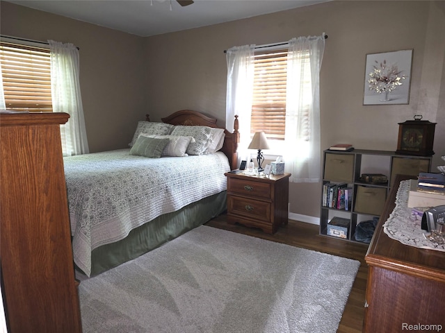 11019 Washington Ave, Mount Morris, MI 48458 - bedroom with dark wood-style floors and baseboards