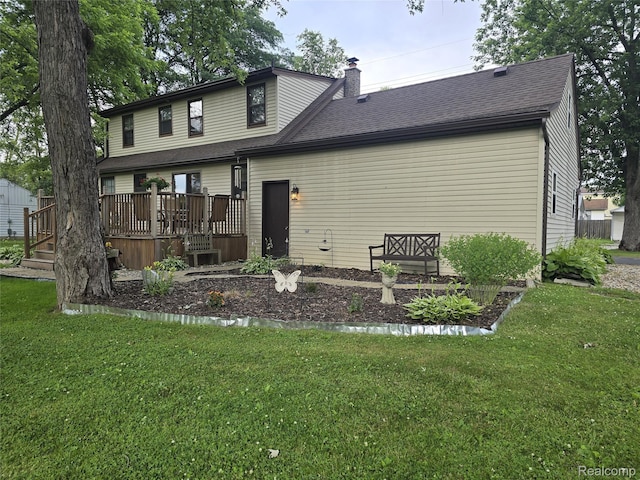 11019 Washington Ave, Mount Morris, MI 48458 - back of property with a deck, a chimney, a yard, and a shingled roof