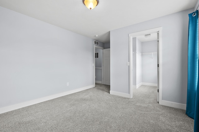 5661 Attleberry Ave, Kalamazoo, MI 49009 - unfurnished bedroom with carpet, a spacious closet, and a closet