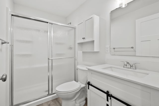 5661 Attleberry Ave, Kalamazoo, MI 49009 - full bathroom with vanity, a shower stall, and wood finished floors
