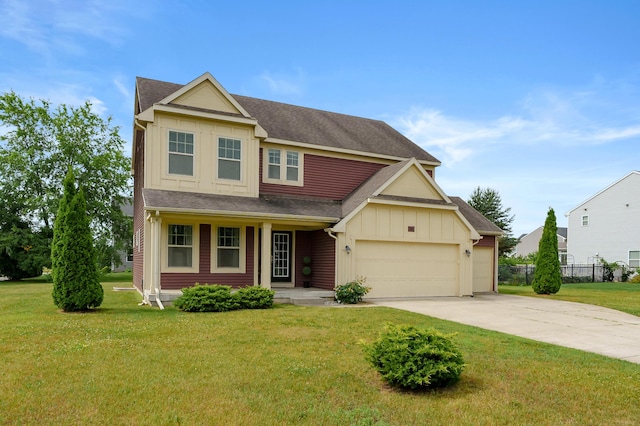 5661 Attleberry Ave, Kalamazoo, MI 49009 - view of front facade with board and batten siding, driveway, covered porch, a garage, and roof with shingles