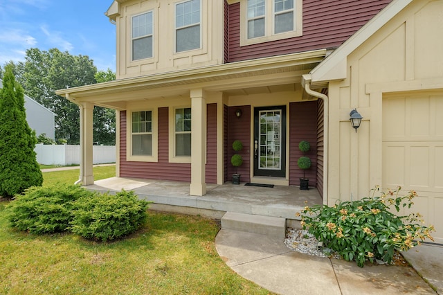 5661 Attleberry Ave, Kalamazoo, MI 49009 - doorway to property with a porch, a garage, and board and batten siding
