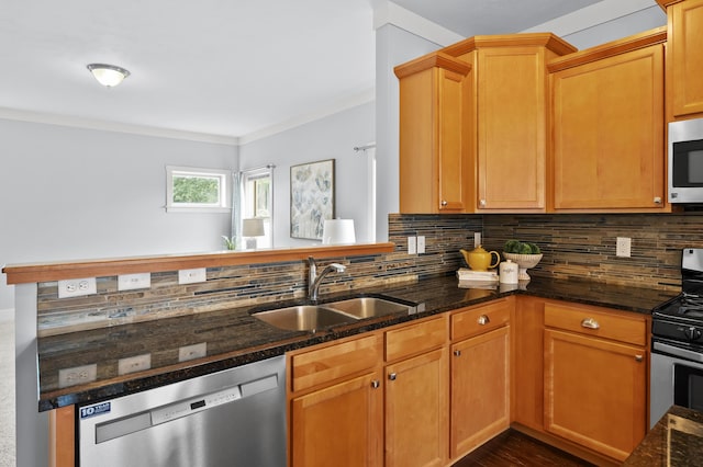 5661 Attleberry Ave, Kalamazoo, MI 49009 - kitchen featuring stainless steel appliances, backsplash, dark stone counters, and dark wood-style floors