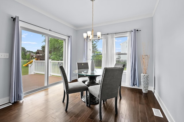 5661 Attleberry Ave, Kalamazoo, MI 49009 - dining space featuring a chandelier, dark wood-style flooring, and ornamental molding