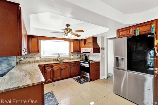 2308 Kipling Dr, Sterling Heights, MI 48310 - kitchen featuring stainless steel appliances, custom range hood, tasteful backsplash, ceiling fan, and light stone counters