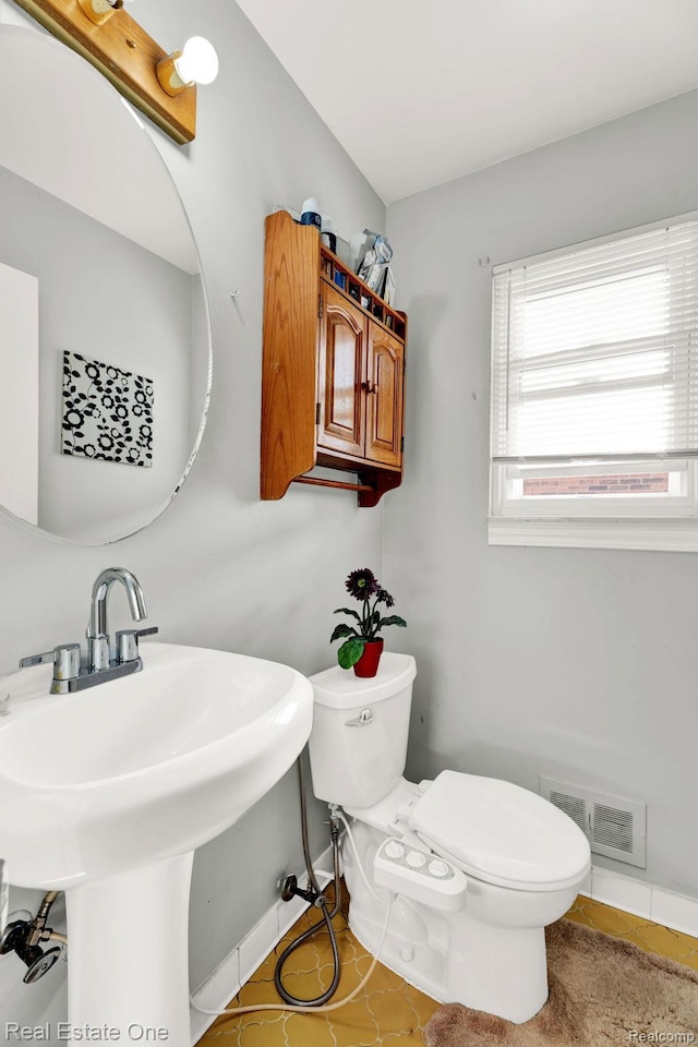 2308 Kipling Dr, Sterling Heights, MI 48310 - bathroom with toilet and tile patterned flooring
