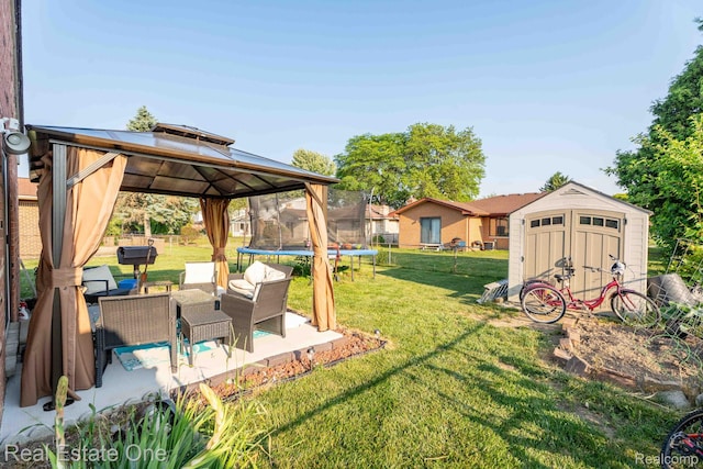 2308 Kipling Dr, Sterling Heights, MI 48310 - view of grassy yard featuring a trampoline, a storage unit, a gazebo, a patio, and outdoor lounge area