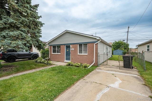 20327 Ellis St, Roseville, MI 48066 - view of front facade featuring brick siding and a storage shed