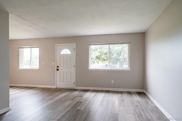 20327 Ellis St, Roseville, MI 48066 - entrance foyer featuring a textured ceiling and wood finished floors