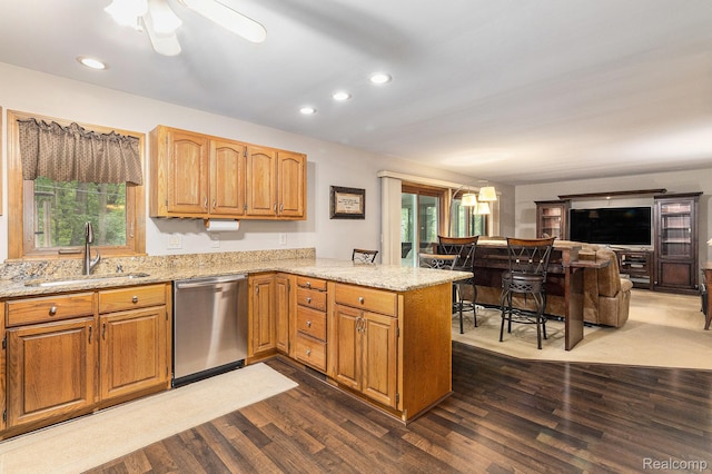 3349 Shimmons Rd, Auburn Hills, MI 48326 - kitchen with dishwasher, a peninsula, dark wood-type flooring, light stone countertops, and recessed lighting