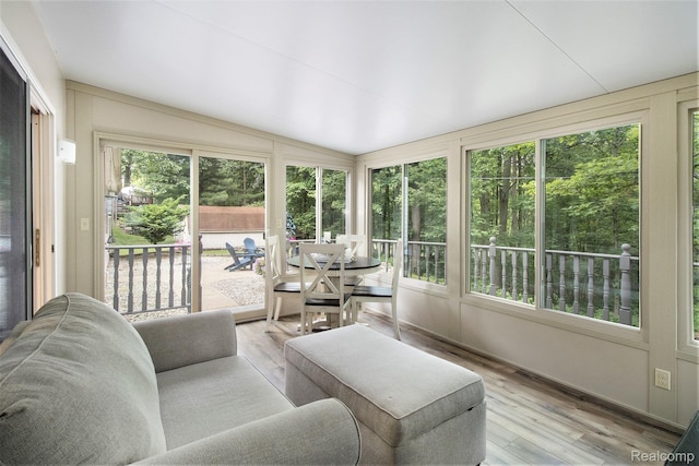 3349 Shimmons Rd, Auburn Hills, MI 48326 - sunroom with wood finished floors and lofted ceiling