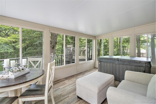 3349 Shimmons Rd, Auburn Hills, MI 48326 - sunroom / solarium with a jacuzzi, wood finished floors, vaulted ceiling, and a wooden deck