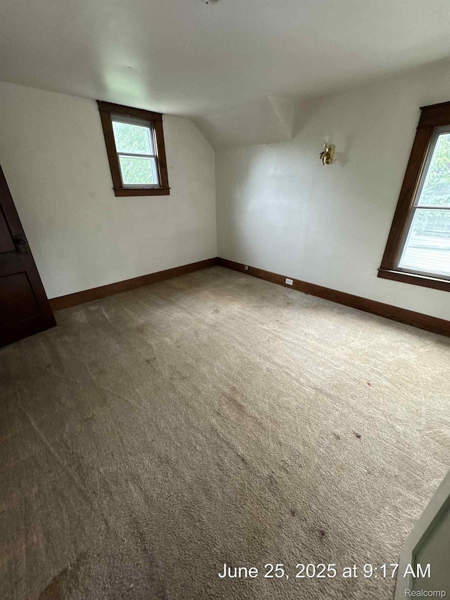 1431 Durand St, Flint, MI 48503 - additional living space with carpet flooring, plenty of natural light, and lofted ceiling