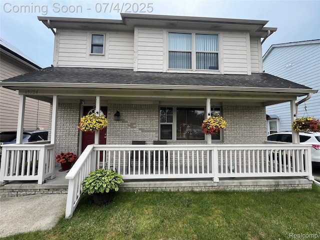 19754 E 14 Mile Rd, Roseville, MI 48066 - view of front of house featuring covered porch, brick siding, and roof with shingles