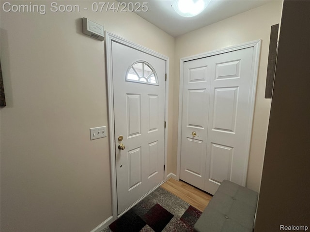 19754 E 14 Mile Rd, Roseville, MI 48066 - doorway to outside featuring light wood-style flooring and baseboards