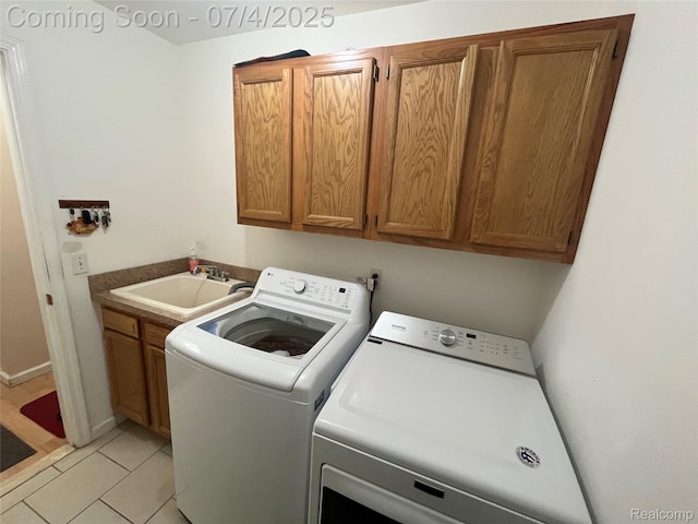 19754 E 14 Mile Rd, Roseville, MI 48066 - laundry area featuring cabinet space, washing machine and dryer, and light tile patterned floors