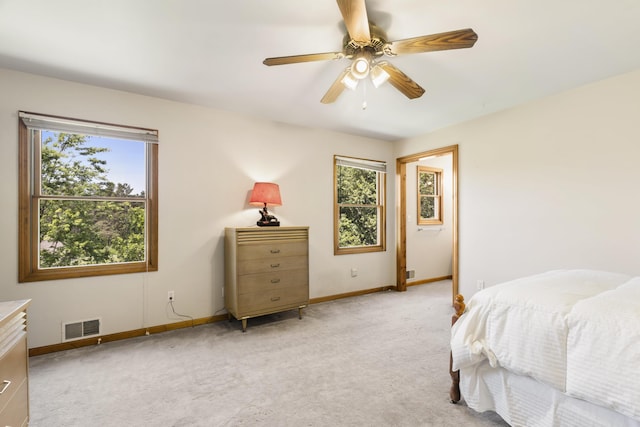 11713 Linderman Rd, Bear Lake, MI 49614 - bedroom featuring light carpet and ceiling fan