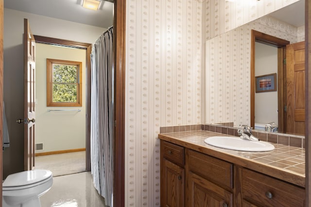 11713 Linderman Rd, Bear Lake, MI 49614 - full bath with vanity and wallpapered walls