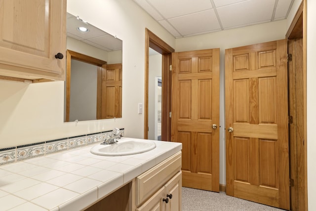11713 Linderman Rd, Bear Lake, MI 49614 - bathroom featuring vanity and a paneled ceiling