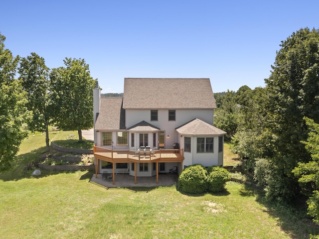 11713 Linderman Rd, Bear Lake, MI 49614 - back of property featuring a deck, a patio, a yard, a chimney, and a shingled roof