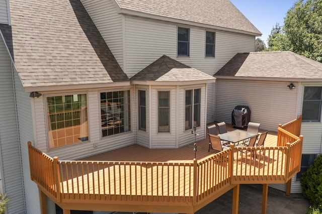 11713 Linderman Rd, Bear Lake, MI 49614 - rear view of property with roof with shingles, a deck, and outdoor dining space