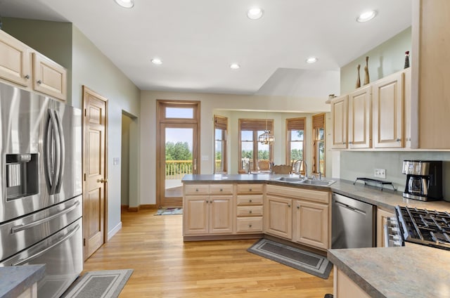 11713 Linderman Rd, Bear Lake, MI 49614 - kitchen with appliances with stainless steel finishes, a peninsula, light brown cabinets, recessed lighting, and light wood-type flooring