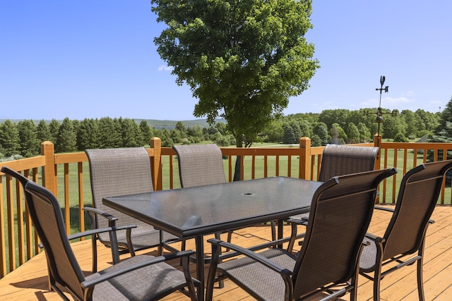 11713 Linderman Rd, Bear Lake, MI 49614 - wooden terrace with outdoor dining space and a forest view