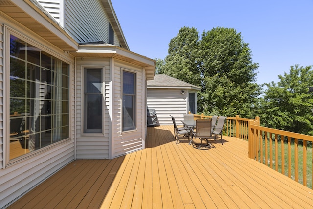 11713 Linderman Rd, Bear Lake, MI 49614 - wooden deck with outdoor dining space