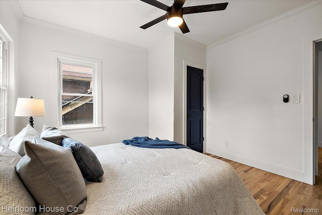 16514 Wildemere St, Detroit, MI 48221 - bedroom featuring light wood-style floors, crown molding, and a ceiling fan