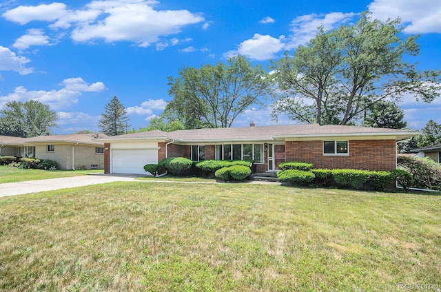 18319 Greenwald Dr, Southfield, MI 48075 - ranch-style home featuring brick siding, a garage, driveway, and a front yard