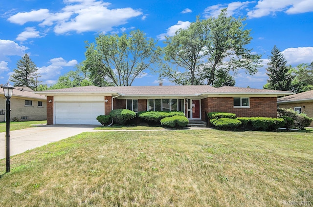 18319 Greenwald Dr, Southfield, MI 48075 - ranch-style home with an attached garage, brick siding, concrete driveway, and a front yard
